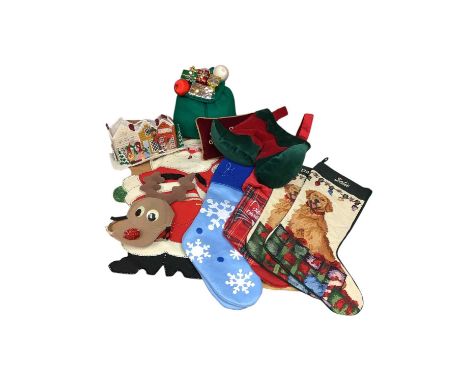 Two boxes of Christmas related textiles to include stockings, cushions and other items (2 boxes)