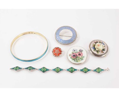 Four silver/white metal brooches all with enamel decoration, silver and blue enamel bangle and an Art Nouveau style white met