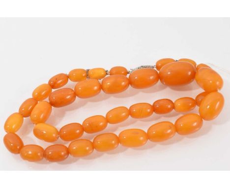 Vintage amber bead necklace with a single string of graduated oval polished beads on silver marcasite clasp, 60cm longTotal w