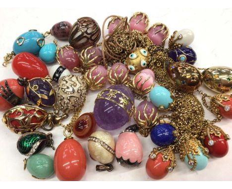 Collection of egg pendants including amethyst, agate, hard stone and enamel with gold, silver gilt and plated mounts, some wi