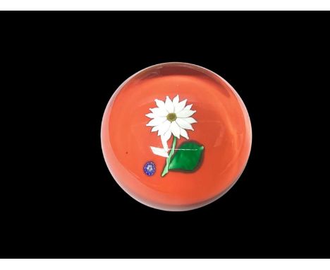 St Louis glass paperweight decorated with a flower on an orange ground, signed and dated 1992, etched mark to baseIn good con