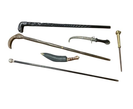 Collection of canes, knives and two tribal harpoons