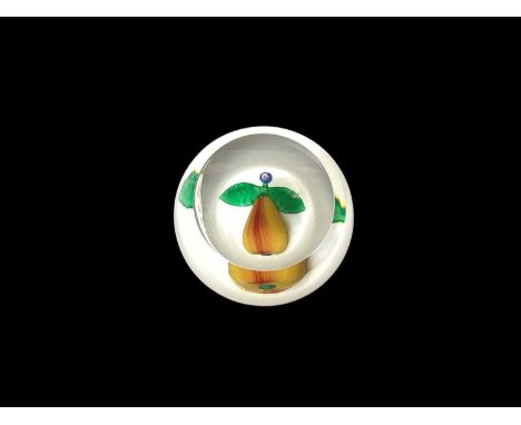 St. Louis glass paperweight decorated with a pear on a white ground, signed and dated 1992, retailed by Asprey