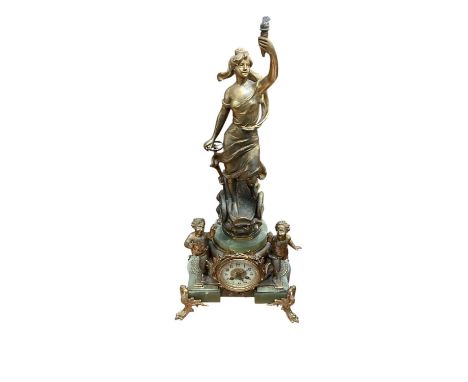 Large antique French gilt spelter and onyx clock, the central female figure steering a carriage, with cherubic figures either