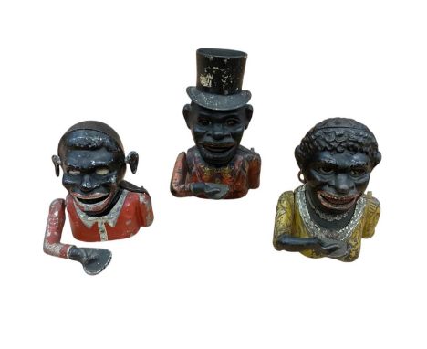 Three figural cast iron money boxes Notice from the the-saleroom.com: These items are listed on the basis they are illustrati