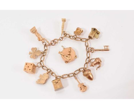 9ct gold charm bracelet with various gold charmsTotal weight 28.7 gramsBracelet and eight charms are all 9ct goldTwo charms s