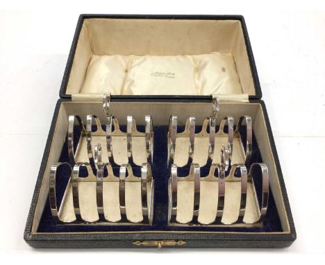 Set of four 1930s silver toast racks in fitted case (Birmingham 1932) by Adie Brothers Ltd.  Toast racks all appear to be in 