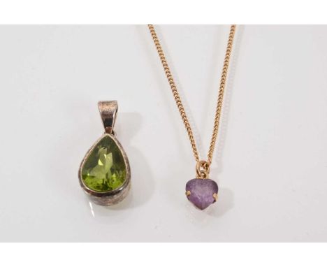 9ct gold mounted amethyst heart shaped pendant on 9ct gold chain, 37.5cm long, and a silver mounted pear shaped peridot penda