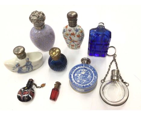 Collection of miniature perfume bottles, some with silver/white metal mountsCircular willow pattern scent bottle has a repair