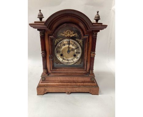 Oak cased bracket clock with side column, brass dial, strikes on a gong, the movement signed Percival, 35cm high