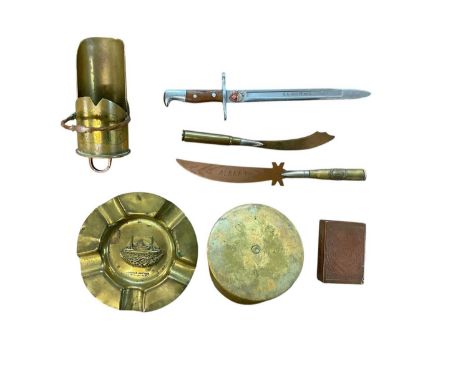 Group of Trench Art items to include a match box cover, coal scuttle, officers cap and ashtray (7 items).