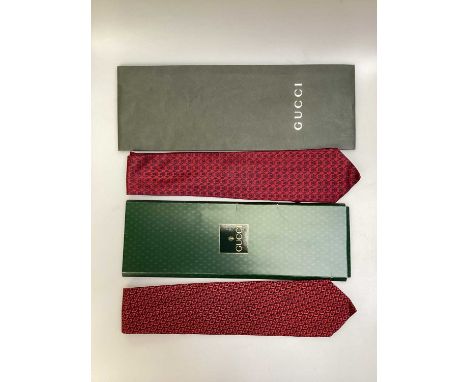 Two Gucci silk ties, one with Gucci logo the other with inter linked initial G, both in Gucci tie packets. Salvatore Ferragam