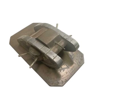First World War Trench Art model of a tank, mounted on brass base engraved "souvenir from France', 12.8cm in overall length.