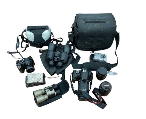 Canon EOS 2000D together with two spare lenses in travel case, Fujifilm Finepix S camera, two digital cameras and two pairs o