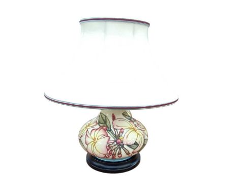Moorcroft pottery table lamp with floral decoration on cream ground