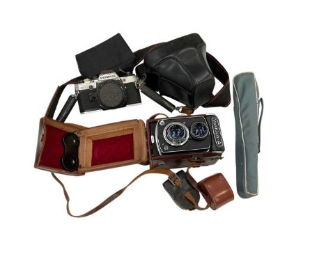 Yashica-A twin lens reflex camera, in case with light meter and tripod, and an Olympus OM10 35mm SLR camera in case with lens