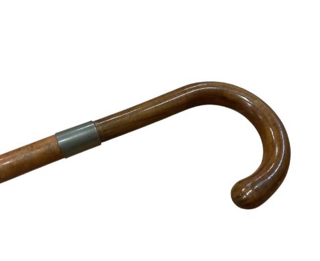 Edwardian gadget walking stick, with Malacca and metal shaft and crook handle, unscrewing to reveal a corkscrew. 88cm overall