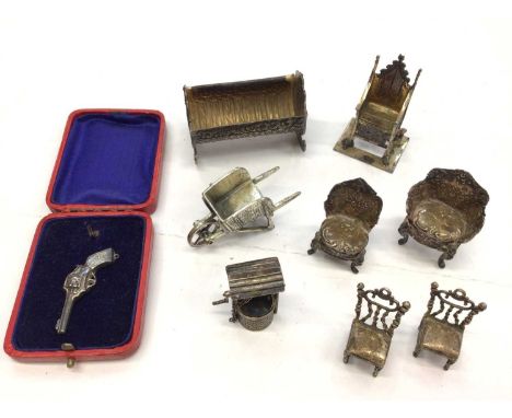 Collection of Victorian and later miniature silver items to include a Victorian cot, Edwardian throne, four chairs, wheelbarr