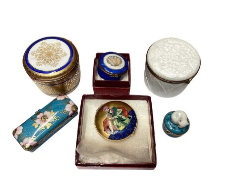 Four Limoges porcelain boxes retailed by Asprey (two boxed), including one as a cat, together with two Limoges boxes retailed