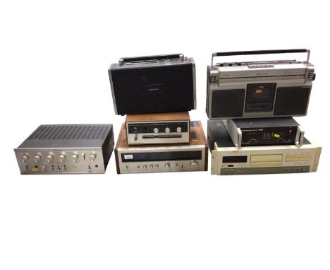 Group of audio equipment, including a Pioneer TX-8100 stereo tuner, Armstrong 521 amplifier, boombox, etc