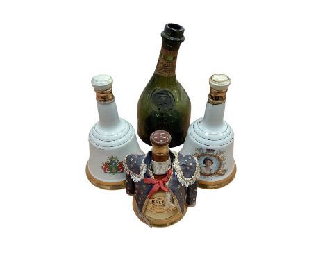 Three commemorative Bell's whisky decanters (full) and an old Armagnac bottle