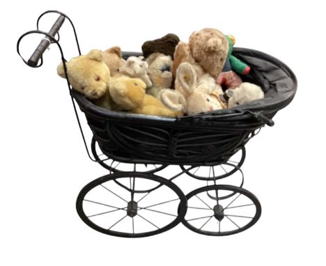 Steiff bunny and other bears housed in a vintage pram