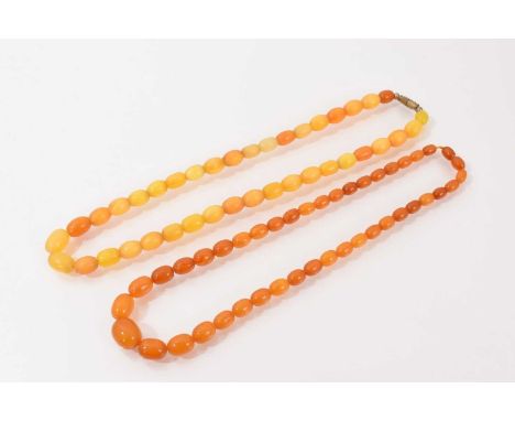 Two vintage amber bead necklaces, the yellow colour amber beads measures 45.5cm long and the orange colour beads measures 44c