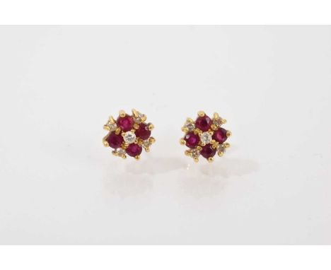 Pair of 18ct gold ruby and diamond cluster earringsWeight 2.4 gramsThe earrings are both in good condition. The settings and 