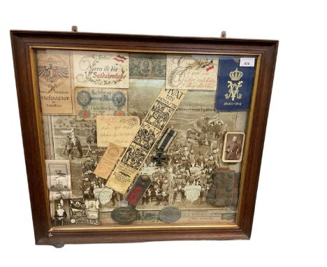 Collection of Imperial German First World War militaria and ephemera mounted in glazed frame including German machine gunners