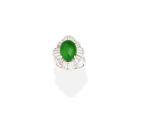 JADE AND DIAMOND BALLERINA RINGThe oval jadeite jade cabochon within an undulating surround, set with tapered baguette-cut di