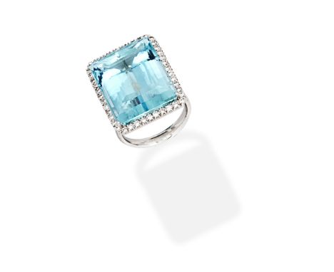 AQUAMARINE AND DIAMOND DRESS RINGThe step-cut aquamarine within a brilliant-cut diamond surround, mounted in 18 carat white g