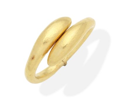 LALAOUNIS: BANGLEThe hinged bangle of crossover design and hammered finish, maker's mark, inner circumference approx. 17.5cm,
