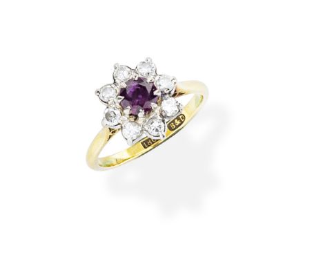 BOODLE &amp; DUNTHORNE: RUBY AND DIAMOND RINGThe circular-cut ruby, within a surround of brilliant-cut diamonds, maker's mark