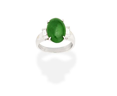 JADE AND DIAMOND RINGThe oval jadeite jade cabochon between baguette-cut diamonds, diamonds approx. 0.30ct total, ring size a