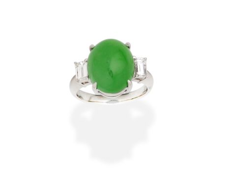 JADE AND DIAMOND RINGThe oval jadeite jade cabochon baguette-cut diamond shoulders, diamonds approx. 0.40ct total, ring size 