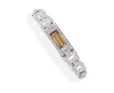 TOPAZ AND DIAMOND BRACELETSet throughout with single-cut diamonds, with a step-cut topaz to the centre, length 18.5cm For fur