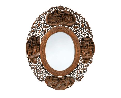 A Chinese export carved and pierced wood oval mirror, Canton, circa 1850,  the foliate frame incorporating four figurative pa