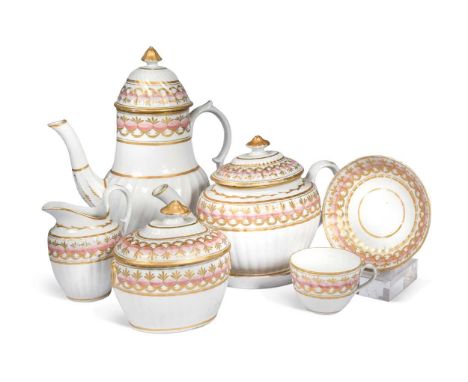 A Chamberlain Worcester tea and coffee service, circa 1800, of spirally fluted form, decorated with a band of pink ovals with