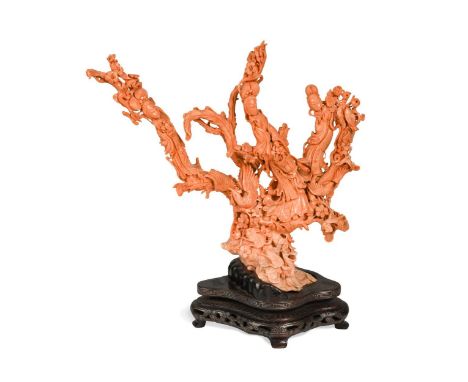 A Chinese large red coral three Guanyin carving, early 20th century,   the immortals amongst prunus blossoms, songbirds, and 