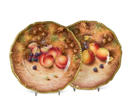 A pair of Royal Worcester plates, painted by T. Nutt with apples, plums, grapes and blackberries on a mossy ground 26cm diame