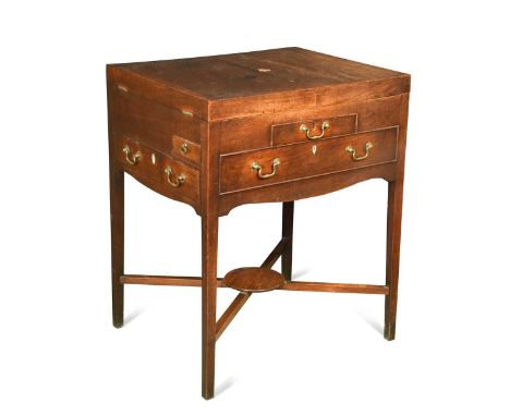 A George III mahogany wash stand, the twin hinged top opening to reveal eight fitted compartments with a further six external