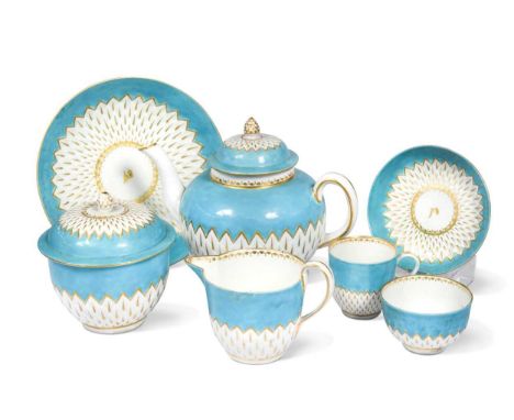 A Derby tea service, circa 1775 – 80, moulded with bands of overlapping scales picked out in gilt, reserved on a bright turqu