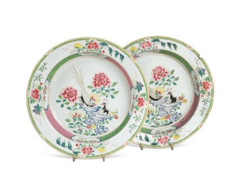 A pair of Chinese famille rose porcelain basins, Qianlong Period, circa 1740,  each depicting a pair of pheasant on blue rock