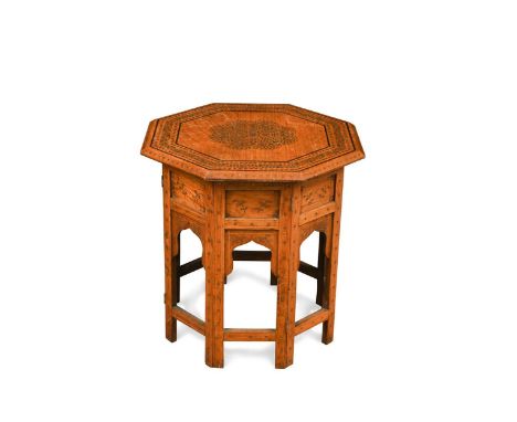 A Hoshiapur octagonal teak occasional table, early 20th century, the top with central copper and brass inlaid medallion and e