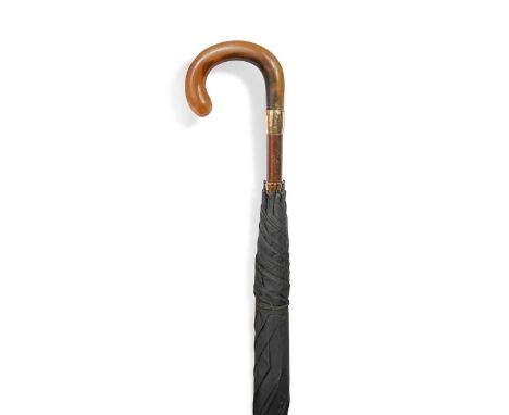 A George V gold mounted umbrella with rhino horn handle, London 1929, the gold ferrule inscribed W R Ponting, with a curved h