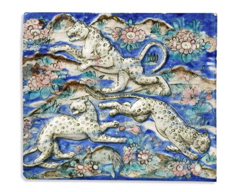 A moulded Islamic Persian Qajar tile, 19th century 29 x 33.5cmUsual glaze crazing extending to hiarline cracks in places. Chi