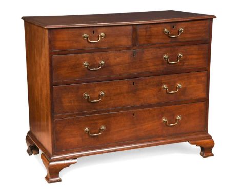 A George III mahogany chest of drawers, the moulded top above two short over three long graduating cockbeaded drawers on ogee