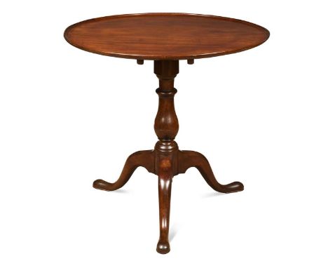 A George III mahogany dish top tripod table, the circular tilt-top over a turned column with cabriole legs on pad feet69 x 72