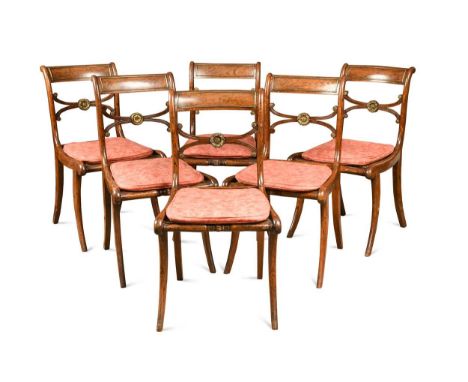 A set of nine Regency faux-rosewood dining chairs, on sabre front and back legs84 x 45 x 56cmProvenance:Private collection, M