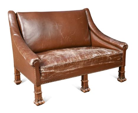 A French Gothic style walnut two-seater sofa, 19th century, the rectangular high back and arms upholstered in a studded faux 